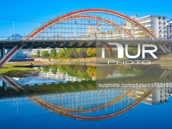 Workers carry out maintenance work on the Nanyuan Bridge in Yuexi County, Anqing City, East China's Anhui Province, on November 8, 2024. (