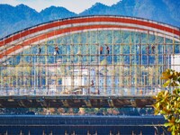 Workers carry out maintenance work on the Nanyuan Bridge in Yuexi County, Anqing City, East China's Anhui Province, on November 8, 2024. (