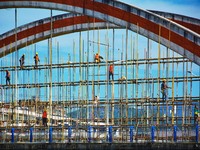 Workers carry out maintenance work on the Nanyuan Bridge in Yuexi County, Anqing City, East China's Anhui Province, on November 8, 2024. (