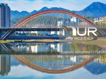 Workers carry out maintenance work on the Nanyuan Bridge in Yuexi County, Anqing City, East China's Anhui Province, on November 8, 2024. (