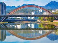 Workers carry out maintenance work on the Nanyuan Bridge in Yuexi County, Anqing City, East China's Anhui Province, on November 8, 2024. (