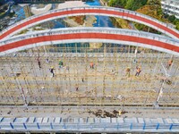 Workers carry out maintenance work on the Nanyuan Bridge in Yuexi County, Anqing City, East China's Anhui Province, on November 8, 2024. (