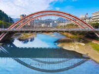 Workers carry out maintenance work on the Nanyuan Bridge in Yuexi County, Anqing City, East China's Anhui Province, on November 8, 2024. (