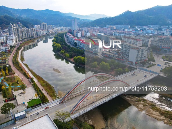 Workers carry out maintenance work on the Nanyuan Bridge in Yuexi County, Anqing City, East China's Anhui Province, on November 8, 2024. 