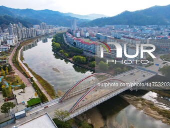 Workers carry out maintenance work on the Nanyuan Bridge in Yuexi County, Anqing City, East China's Anhui Province, on November 8, 2024. (