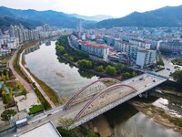 Workers carry out maintenance work on the Nanyuan Bridge in Yuexi County, Anqing City, East China's Anhui Province, on November 8, 2024. (