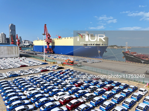 A roll-on wheel is loaded with cars for export at the terminal of Orient Port Branch in Lianyungang Port in Lianyungang, China, on November...