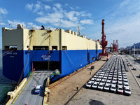 A roll-on wheel is loaded with cars for export at the terminal of Orient Port Branch in Lianyungang Port in Lianyungang, China, on November...