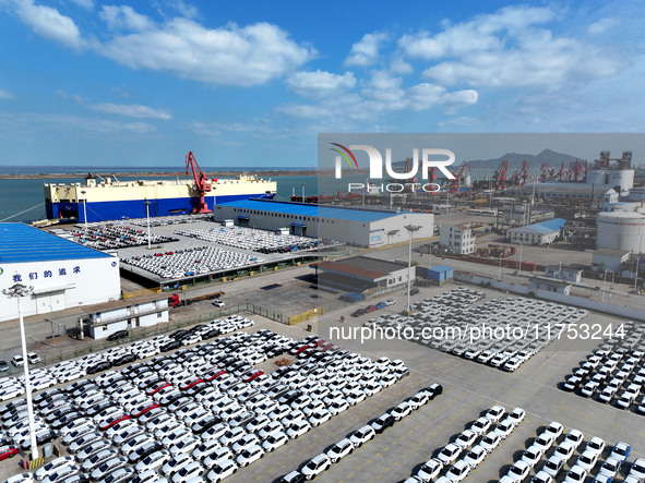 A roll-on wheel is loaded with cars for export at the terminal of Orient Port Branch in Lianyungang Port in Lianyungang, China, on November...