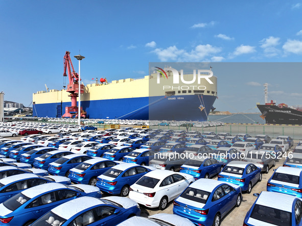 A roll-on wheel is loaded with cars for export at the terminal of Orient Port Branch in Lianyungang Port in Lianyungang, China, on November...