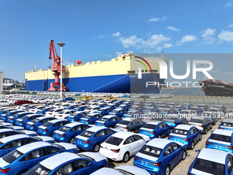 A roll-on wheel is loaded with cars for export at the terminal of Orient Port Branch in Lianyungang Port in Lianyungang, China, on November...