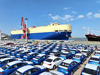 A roll-on wheel is loaded with cars for export at the terminal of Orient Port Branch in Lianyungang Port in Lianyungang, China, on November...