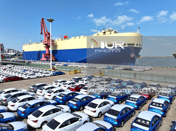 A roll-on wheel is loaded with cars for export at the terminal of Orient Port Branch in Lianyungang Port in Lianyungang, China, on November...