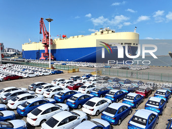 A roll-on wheel is loaded with cars for export at the terminal of Orient Port Branch in Lianyungang Port in Lianyungang, China, on November...