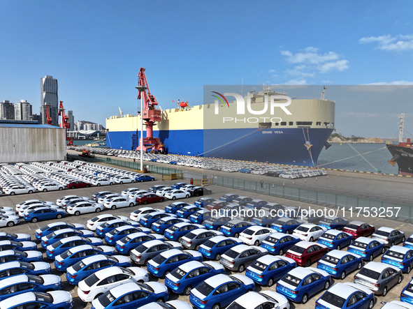 A roll-on wheel is loaded with cars for export at the terminal of Orient Port Branch in Lianyungang Port in Lianyungang, China, on November...