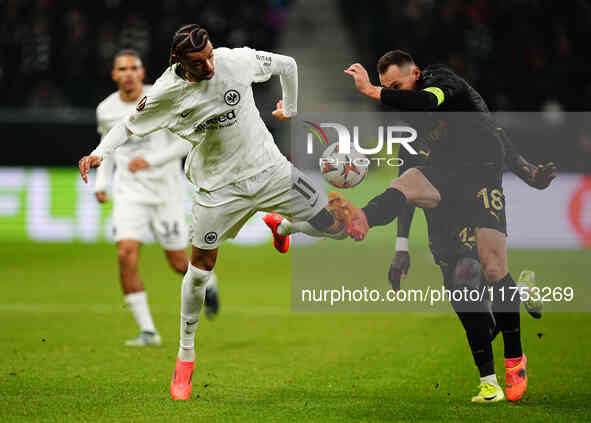 Hugo Ekitike of Eintracht Frankfurt and Jan Boril of SK Slavia Prague battle for the ball during the Eurepa League Round 4 match between Ein...