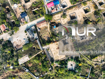 An aerial photo taken in Sanmenxia, China, on November 7, 2024, shows the Pit yard of Qucun Village, Xizhang Township, Shanzhou District, He...