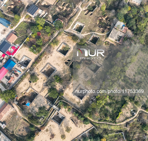 An aerial photo taken in Sanmenxia, China, on November 7, 2024, shows the Pit yard of Qucun Village, Xizhang Township, Shanzhou District, He...