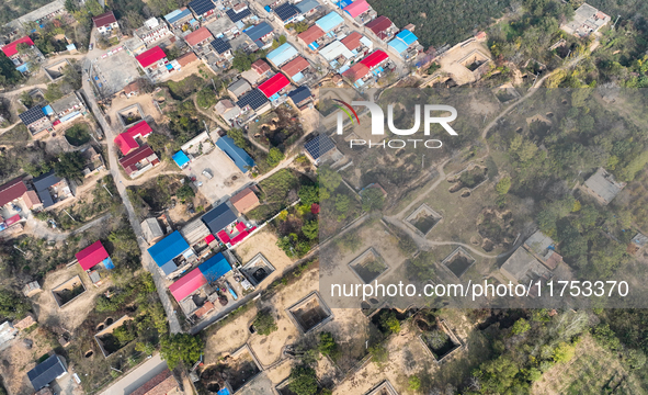 An aerial photo taken in Sanmenxia, China, on November 7, 2024, shows the Pit yard of Qucun Village, Xizhang Township, Shanzhou District, He...