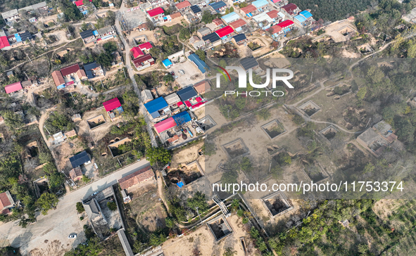 An aerial photo taken in Sanmenxia, China, on November 7, 2024, shows the Pit yard of Qucun Village, Xizhang Township, Shanzhou District, He...