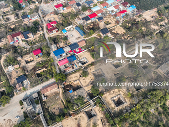 An aerial photo taken in Sanmenxia, China, on November 7, 2024, shows the Pit yard of Qucun Village, Xizhang Township, Shanzhou District, He...