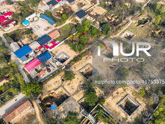 An aerial photo taken in Sanmenxia, China, on November 7, 2024, shows the Pit yard of Qucun Village, Xizhang Township, Shanzhou District, He...