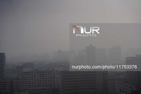 Buildings are faintly visible in the haze in Xi'an, China, on November 8, 2024. 