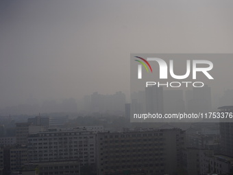 Buildings are faintly visible in the haze in Xi'an, China, on November 8, 2024. (