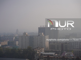 Buildings are faintly visible in the haze in Xi'an, China, on November 8, 2024. (