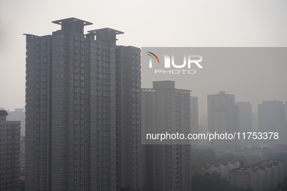 Buildings are faintly visible in the haze in Xi'an, China, on November 8, 2024. 