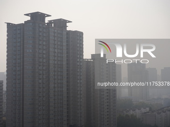 Buildings are faintly visible in the haze in Xi'an, China, on November 8, 2024. (