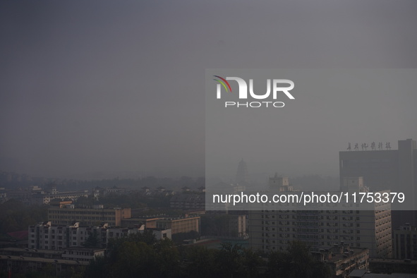 Buildings are faintly visible in the haze in Xi'an, China, on November 8, 2024. 