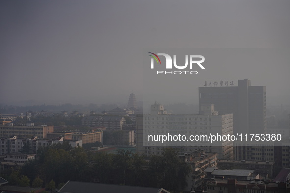 Buildings are faintly visible in the haze in Xi'an, China, on November 8, 2024. 