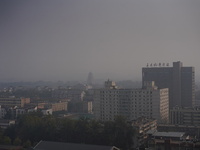 Buildings are faintly visible in the haze in Xi'an, China, on November 8, 2024. (