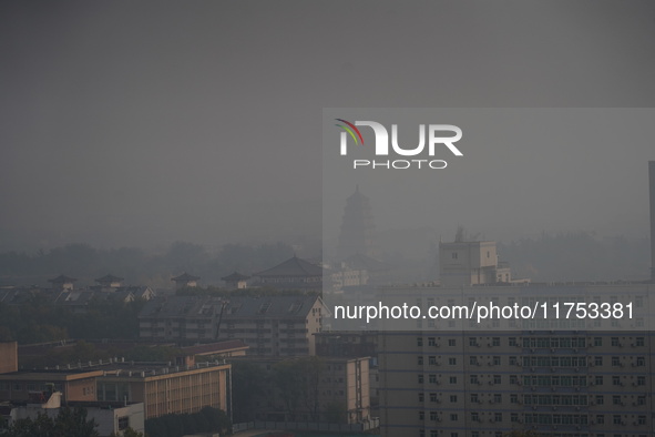 Buildings are faintly visible in the haze in Xi'an, China, on November 8, 2024. 