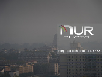 Buildings are faintly visible in the haze in Xi'an, China, on November 8, 2024. (