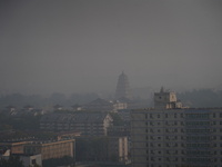 Buildings are faintly visible in the haze in Xi'an, China, on November 8, 2024. (