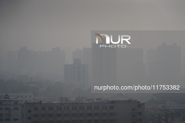 Buildings are faintly visible in the haze in Xi'an, China, on November 8, 2024. 