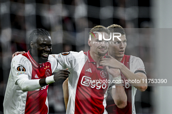 AFC Ajax Amsterdam forward Bertrand Traore, AFC Ajax Amsterdam midfielder Kenneth Taylor, and AFC Ajax Amsterdam defender Anton Gaaei partic...