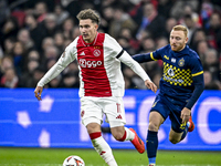 AFC Ajax Amsterdam forward Mika Godts and Maccabi Tel Aviv midfielder Ido Shahar play during the match between Ajax and Maccabi Tel Aviv at...