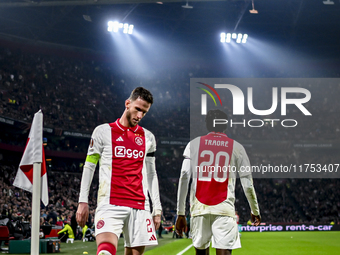 AFC Ajax Amsterdam midfielder Branco van den Boomen and AFC Ajax Amsterdam forward Bertrand Traore play during the match between Ajax and Ma...