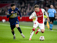 Maccabi Tel Aviv forward Dor Turgeman and AFC Ajax Amsterdam forward Mika Godts play during the match between Ajax and Maccabi Tel Aviv at t...