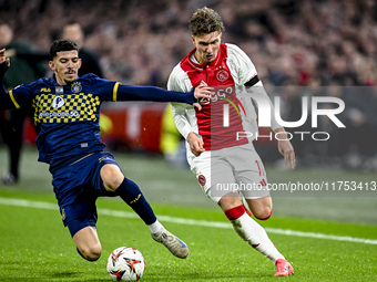 Maccabi Tel Aviv forward Dor Turgeman and AFC Ajax Amsterdam forward Mika Godts play during the match between Ajax and Maccabi Tel Aviv at t...