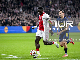 AFC Ajax Amsterdam forward Brian Brobbey and Maccabi Tel Aviv defender Nemanja Stojic play during the match between Ajax and Maccabi Tel Avi...