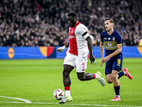 AFC Ajax Amsterdam forward Brian Brobbey and Maccabi Tel Aviv defender Nemanja Stojic play during the match between Ajax and Maccabi Tel Avi...