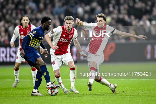 Maccabi Tel Aviv midfielder Issouf Sissokho, AFC Ajax Amsterdam midfielder Kenneth Taylor, and AFC Ajax Amsterdam defender Youri Baas partic...