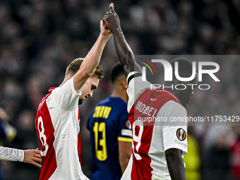 AFC Ajax Amsterdam midfielder Kenneth Taylor and AFC Ajax Amsterdam forward Brian Brobbey play during the match between Ajax and Maccabi Tel...