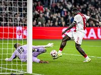 Maccabi Tel Aviv goalkeeper Roi Mishpati and AFC Ajax Amsterdam forward Brian Brobbey participate in the match between Ajax and Maccabi Tel...