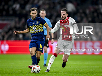 Maccabi Tel Aviv midfielder Joris van Overeem and AFC Ajax Amsterdam midfielder Branco van den Boomen play during the match between Ajax and...