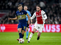 Maccabi Tel Aviv midfielder Joris van Overeem and AFC Ajax Amsterdam midfielder Branco van den Boomen play during the match between Ajax and...